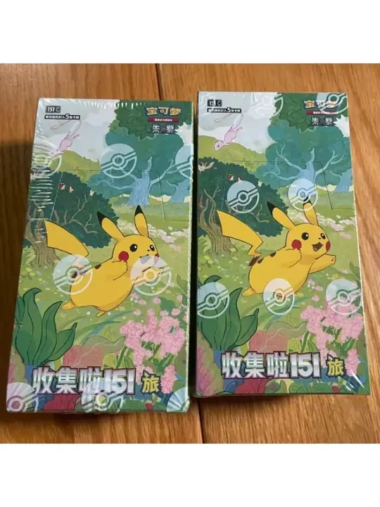 Two green 151 Vol. 1 packages with Pikachu and Mew artwork — Slim SKU reference, not a two-box order