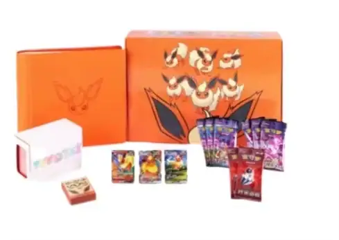 Orange Flareon gift presentation with matching album-like object, pictured cards and packs and a smaller red-and-white box-like component on the left