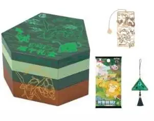 Small green hexagonal tiered Dragon Boat gift box beside a narrow decorative item, hanging ornament and small pack-like reference